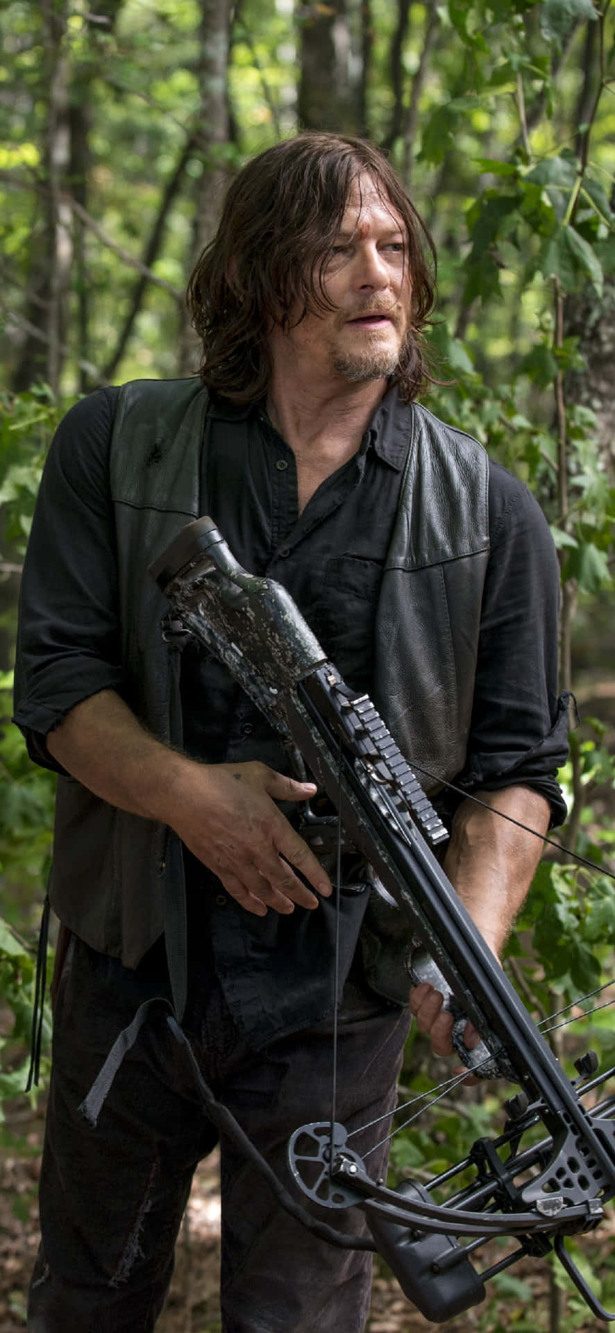Daryl Dixon With Crossbow In Woods.jpg Wallpaper