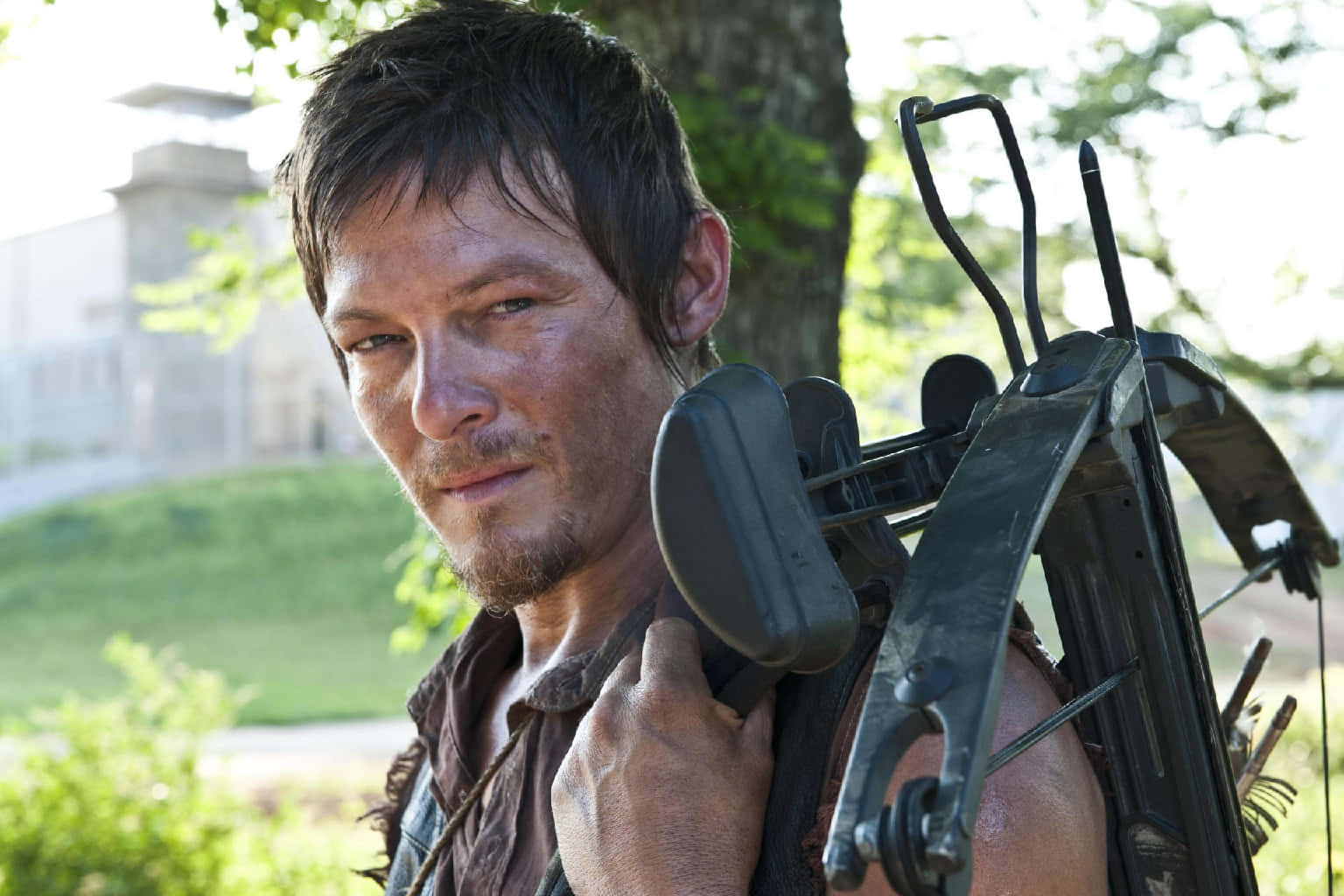 Daryl Dixon With Crossbow Outdoors Wallpaper