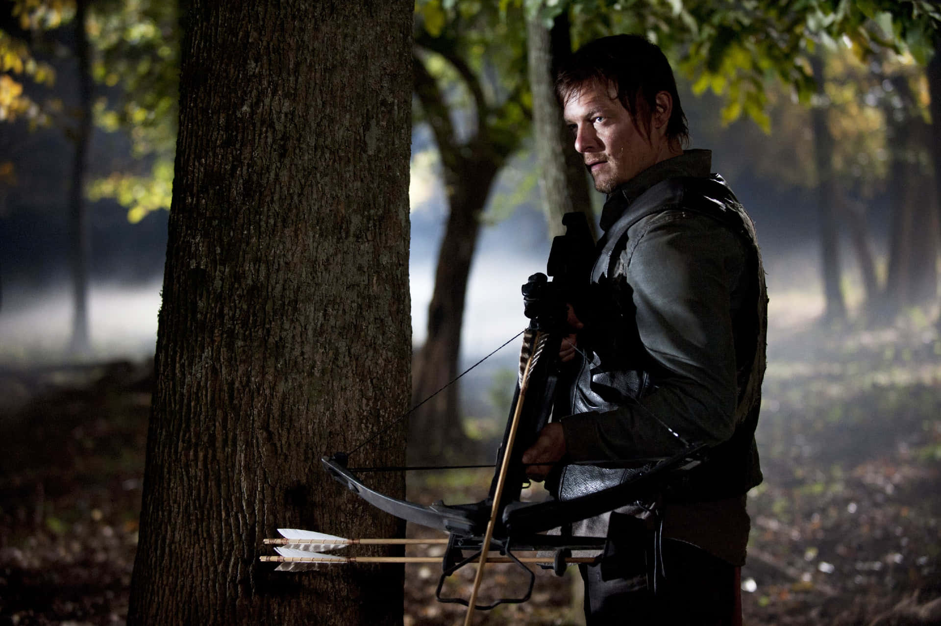 Daryl Dixon With Crossbowin Woods Wallpaper