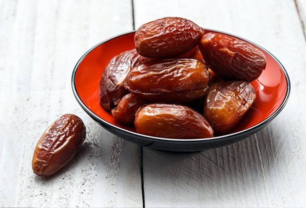 Dates On A Mini Red Bowl Wallpaper