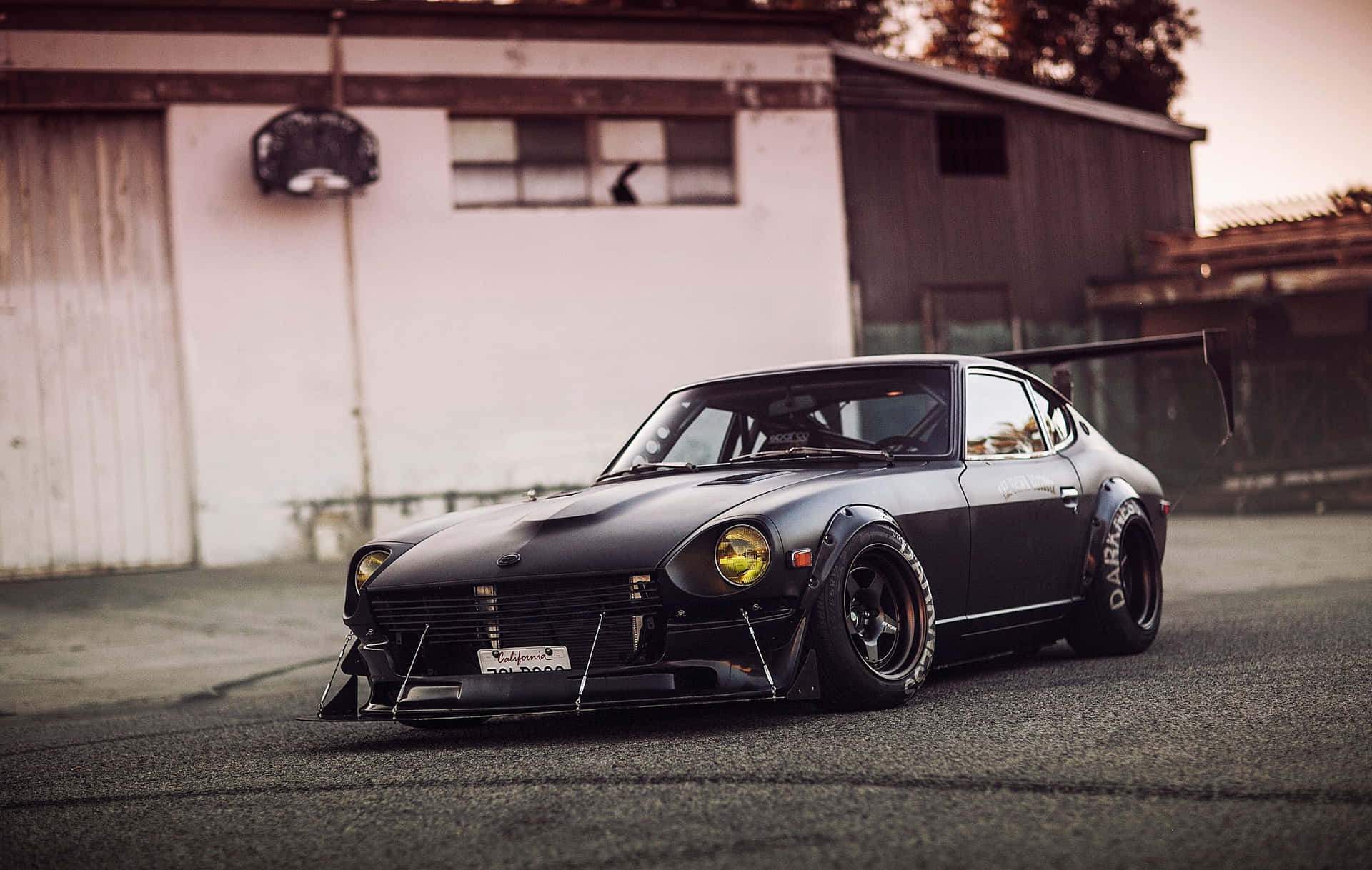 Sleek and stylish silver Datsun captured on a sunny day Wallpaper