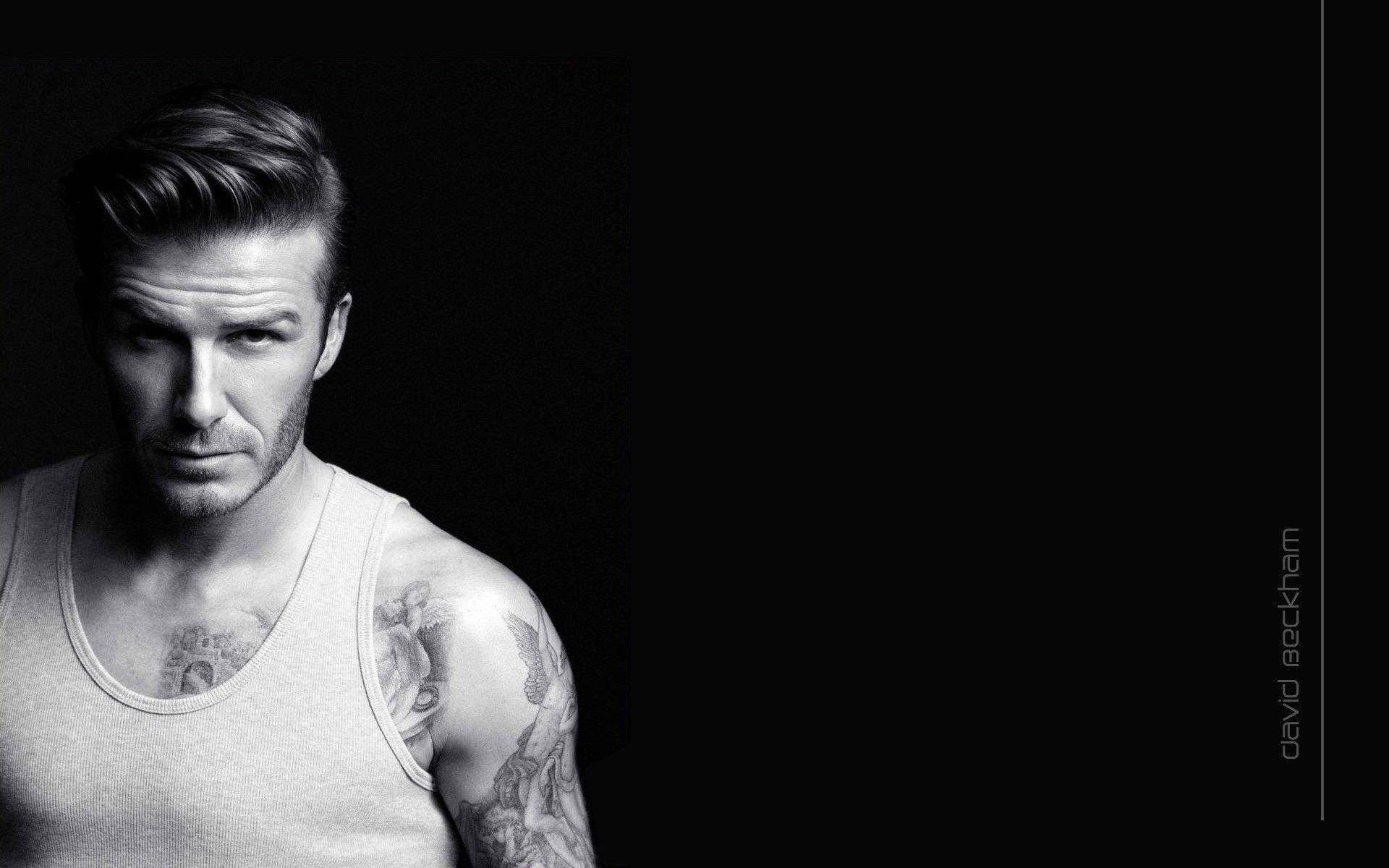 David Beckham shows off his muscular physique in a black tank top Wallpaper