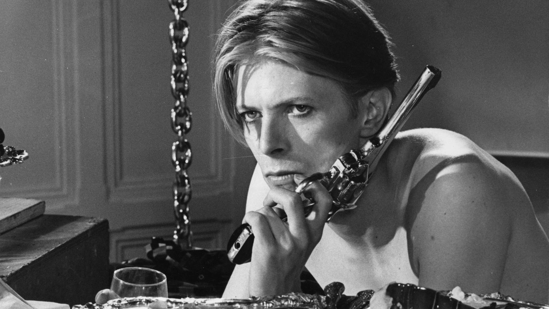 David Bowie With Pistol Wallpaper