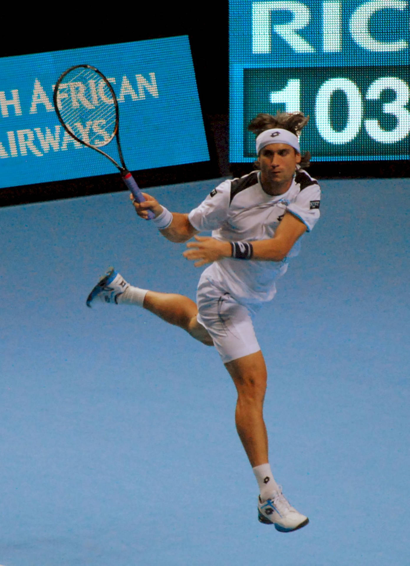 David Ferrer In Action On The Tennis Court. Wallpaper