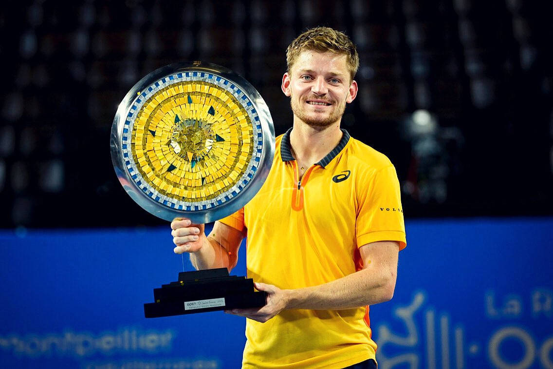 Champion David Goffin With His Trophy Wallpaper