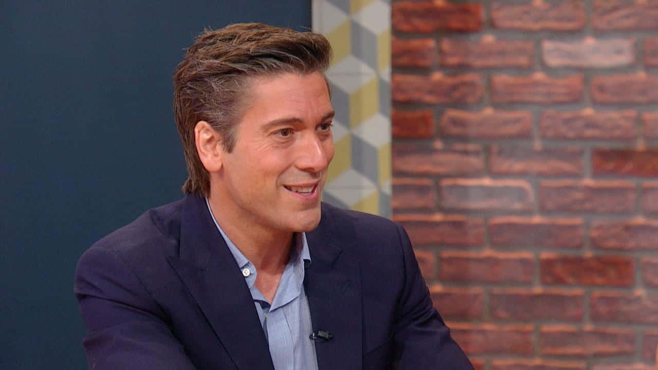 Caption: David Muir during an appearance on the Rachael Ray Show. Wallpaper