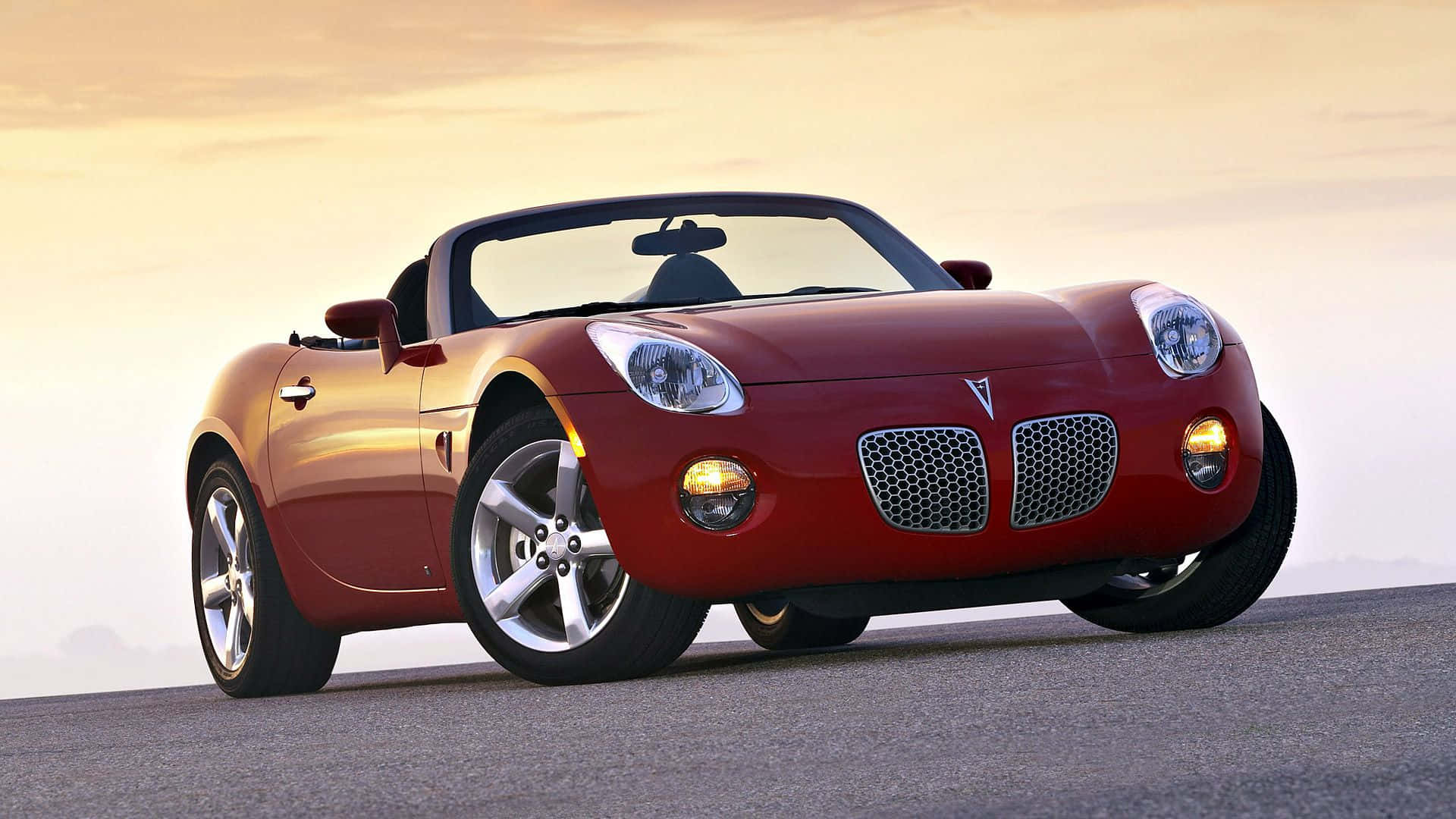 "dazzling Pontiac Solstice Cruising Highway" Wallpaper