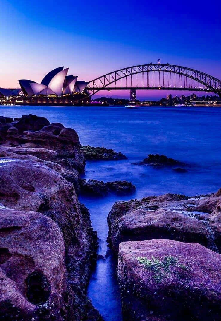 Dazzling Sunset Over Sydney Harbour Bridge In Australia