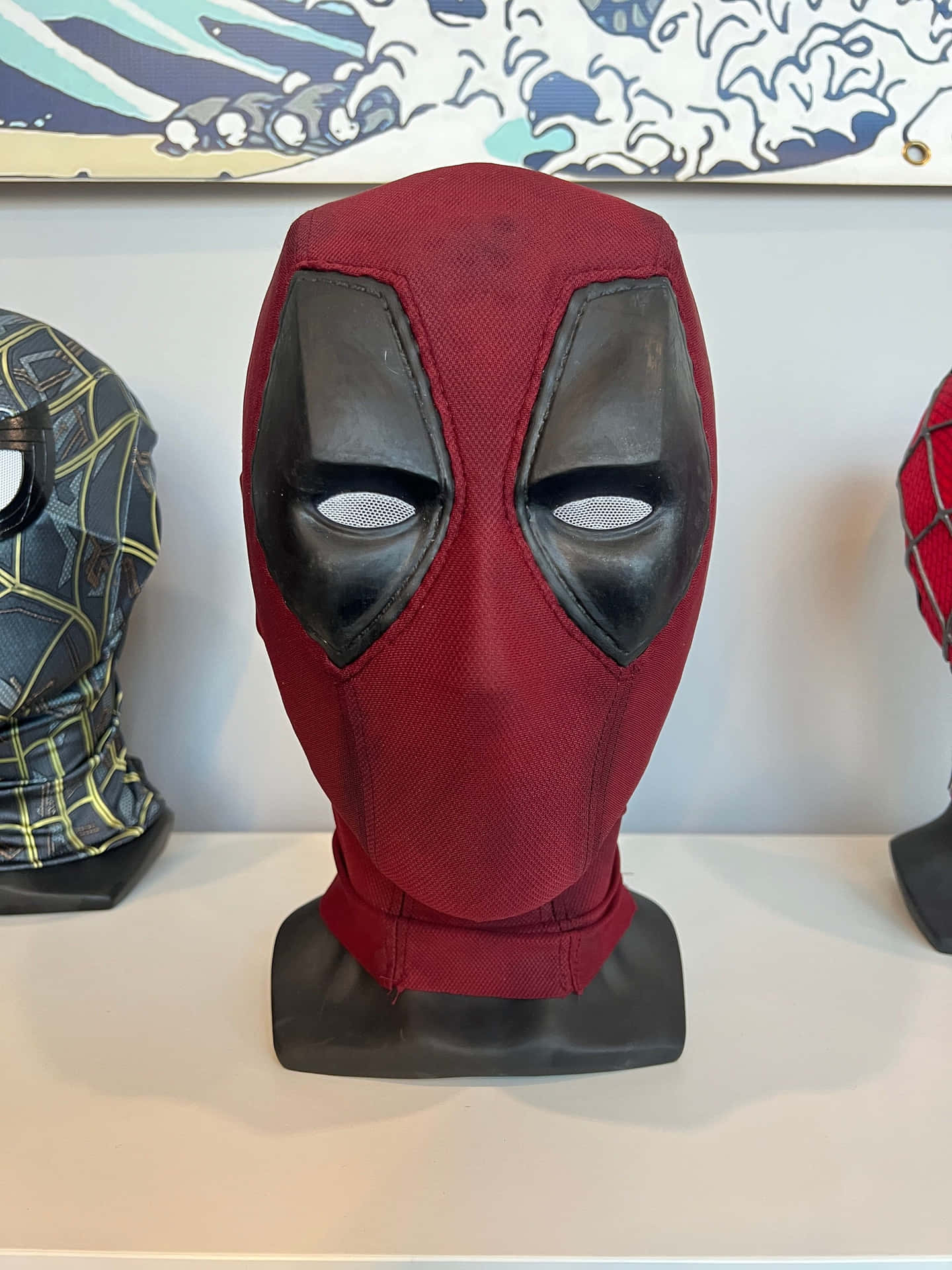 Intense close-up of Deadpool's iconic mask Wallpaper