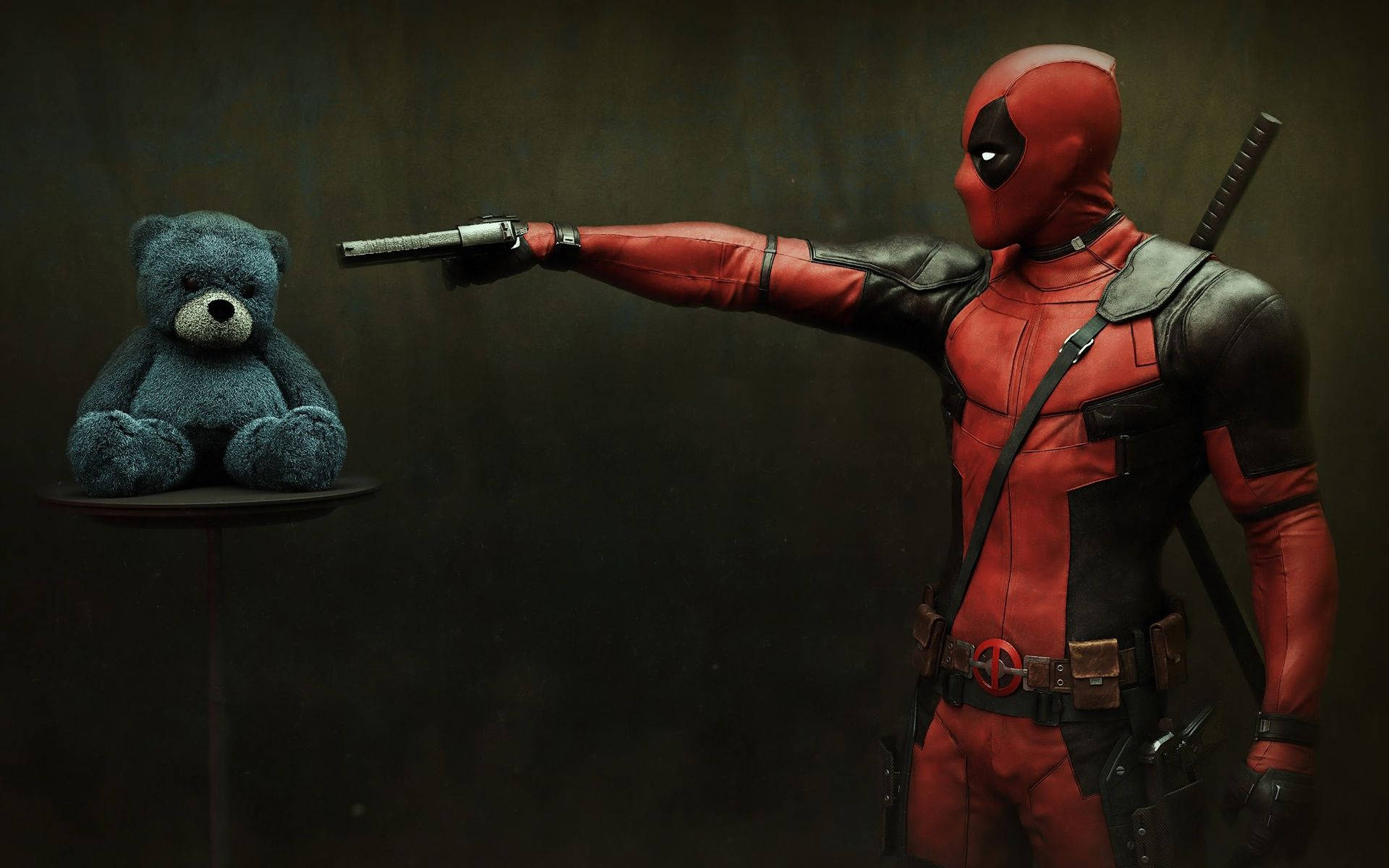 Deadpool Pointing His Gun At Teddy Wallpaper