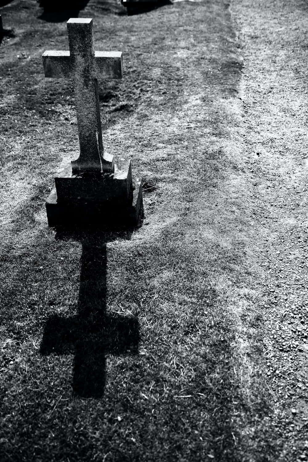 A Black And White Photo Of A Graveyard