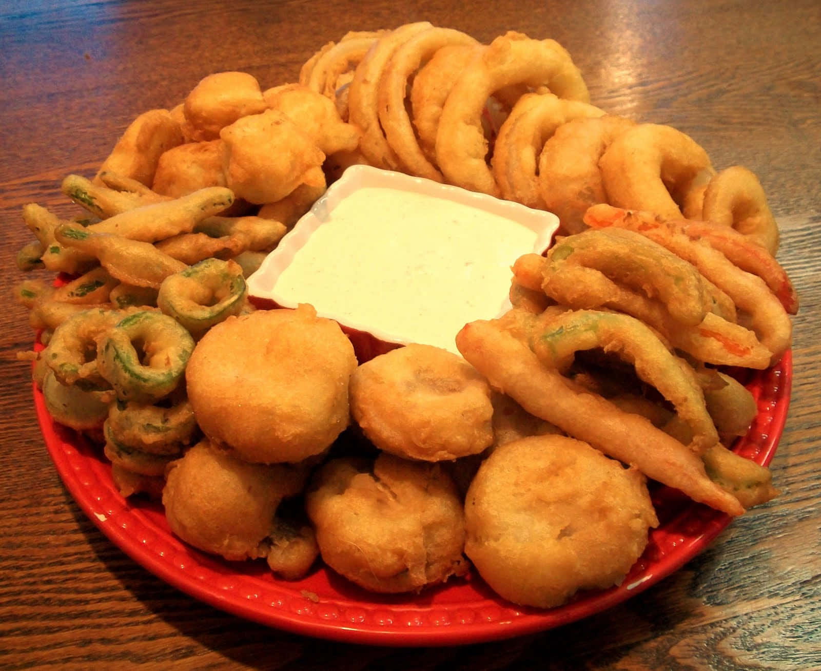 A Red Plate With Fried Food