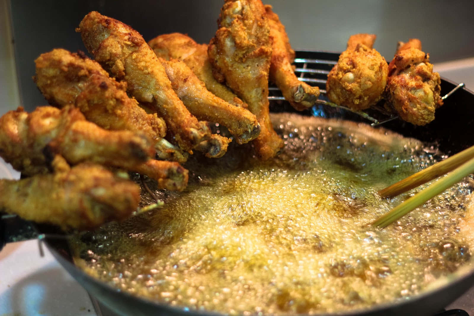 Fried Chicken Wings Being Cooked In A Pan