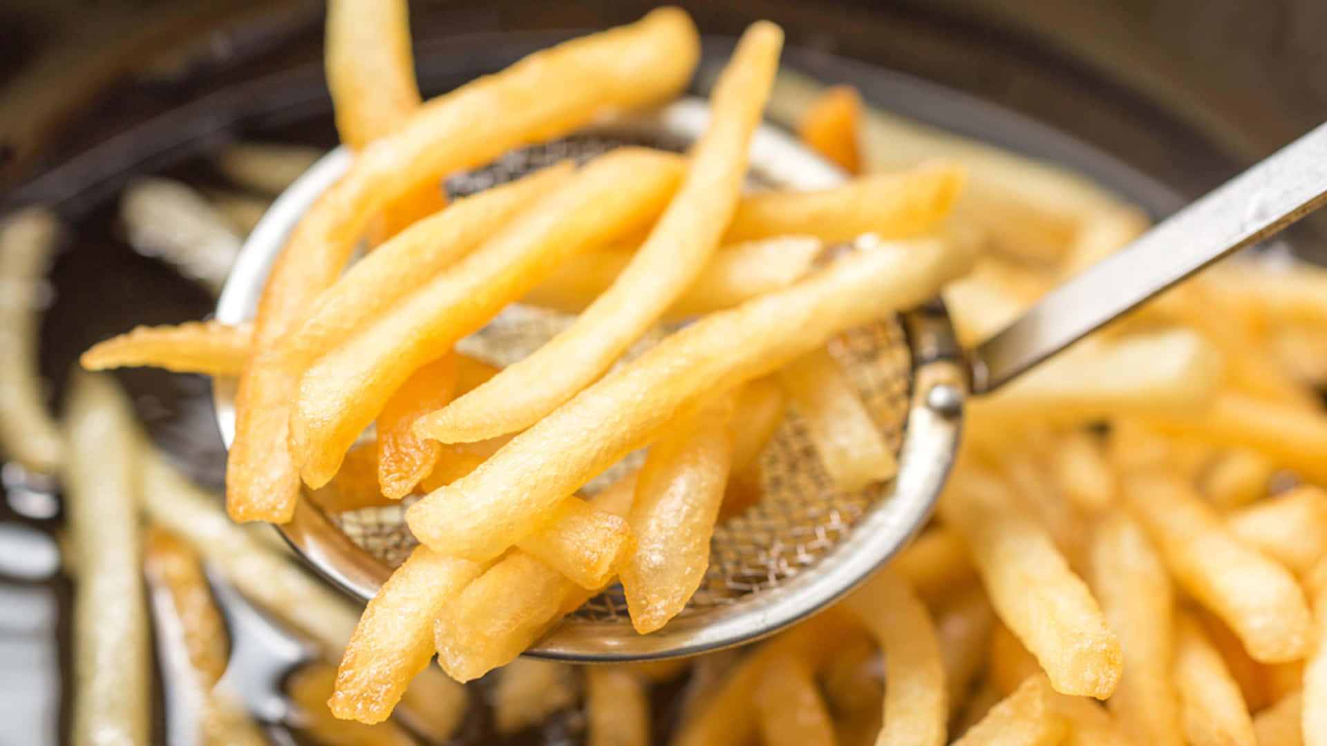 French Fries In A Metal Strainer