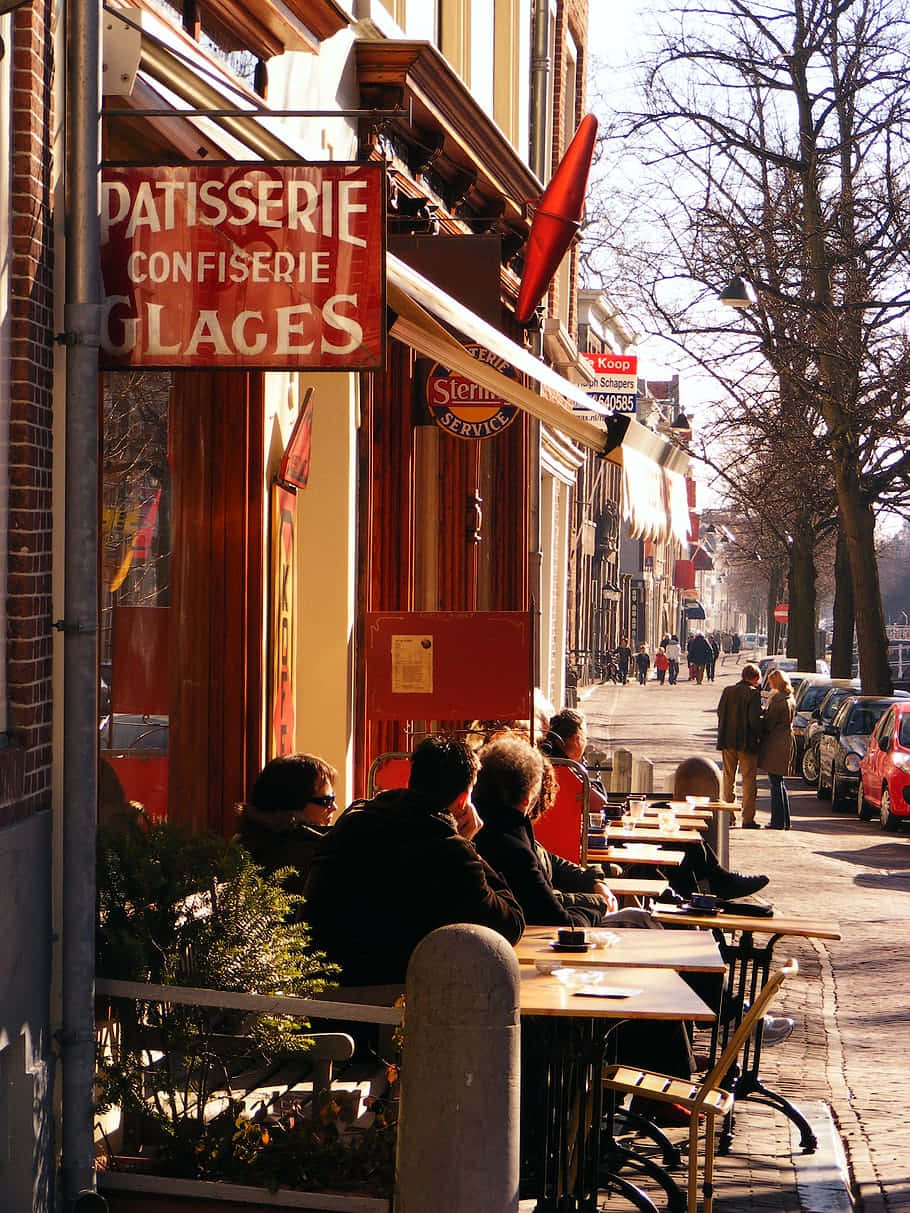 Delft Fortauskafé Patisserie Scene Bakgrunnsbildet