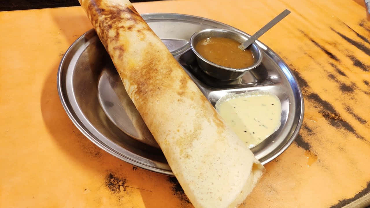 Delicious And Nutritious Indian Cuisine: Crispy Dosa Wallpaper