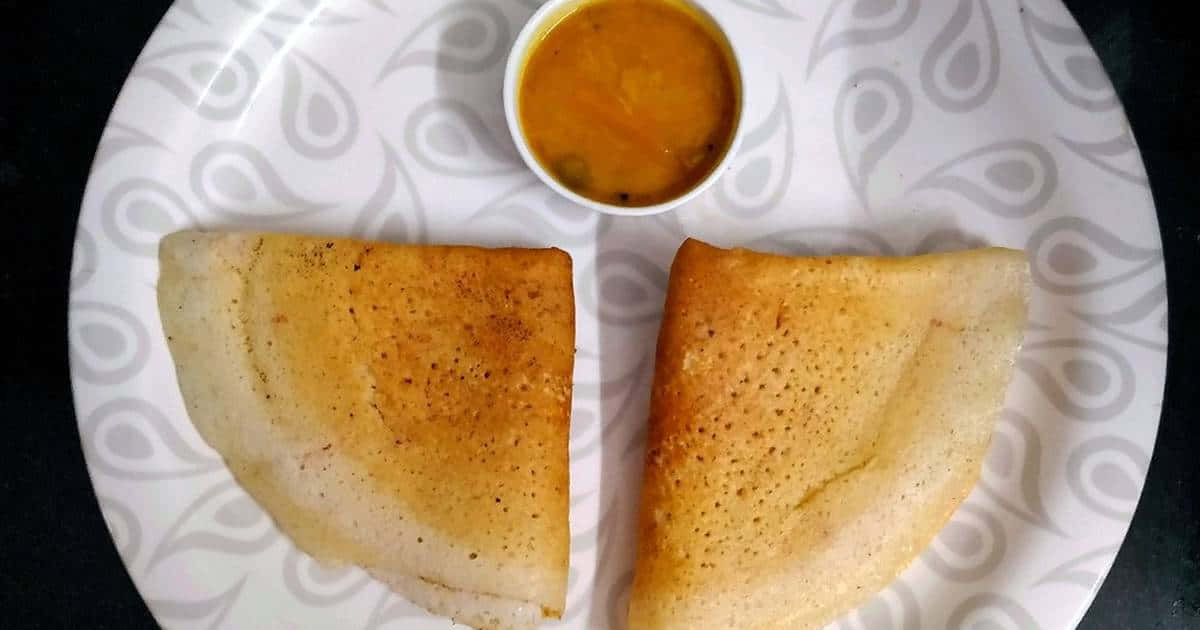 Delicious Homemade Indian Dosa Ready To Be Savored Wallpaper