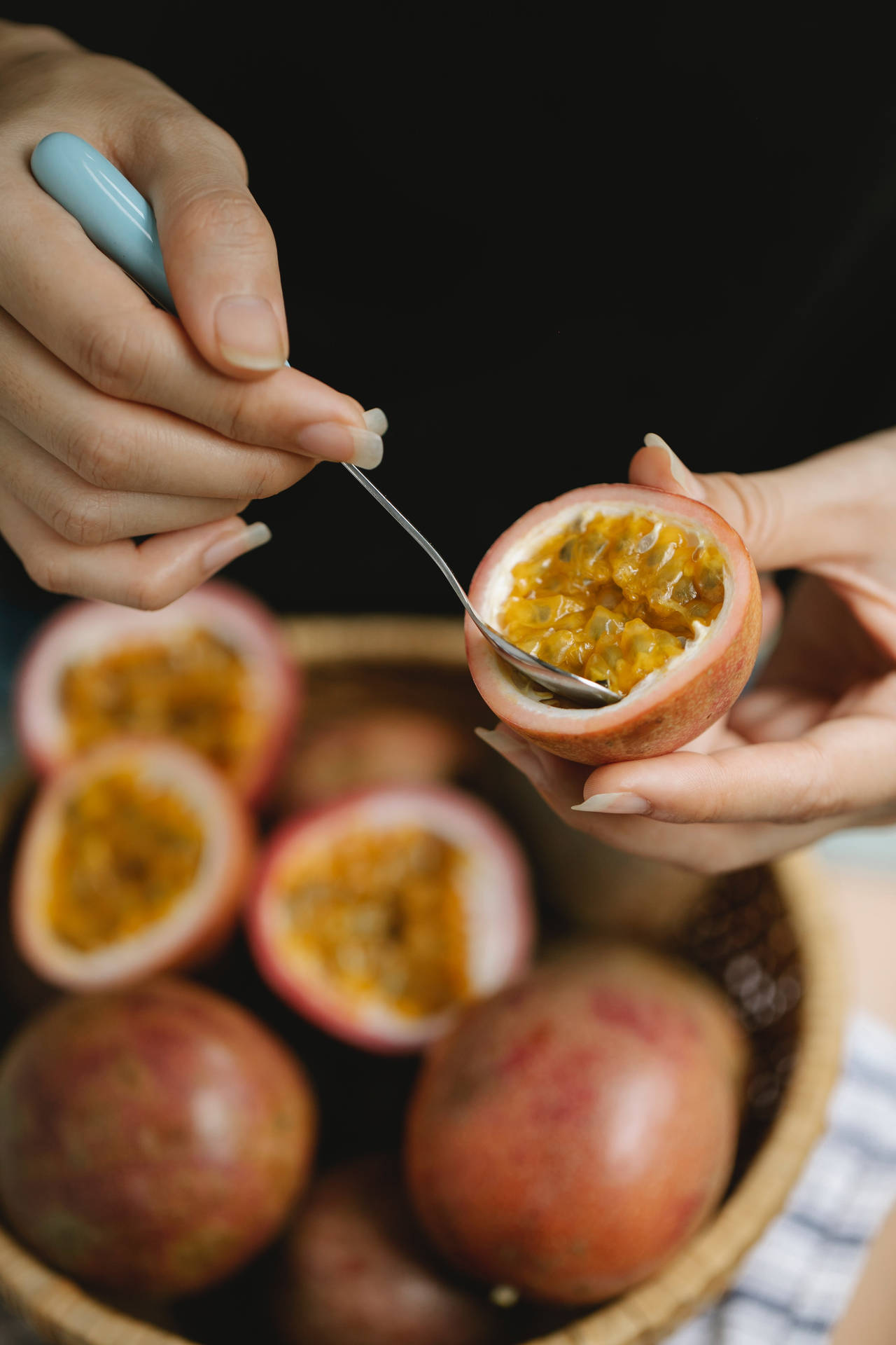 Delicious Passion Fruit Scooped With Spoon Wallpaper