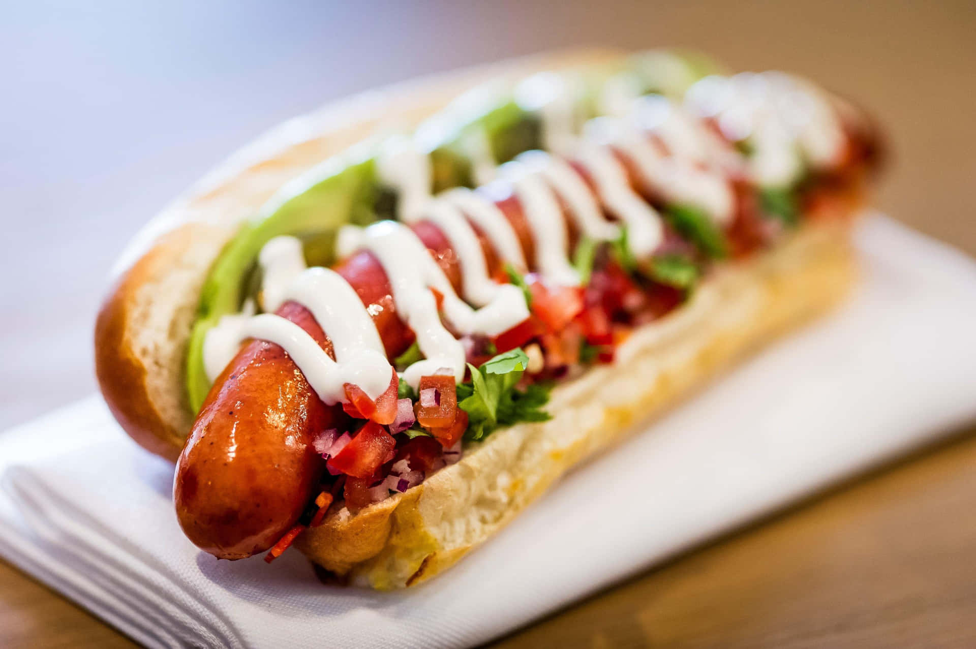 Delightful Gourmet Hot Dog With Fresh Toppings