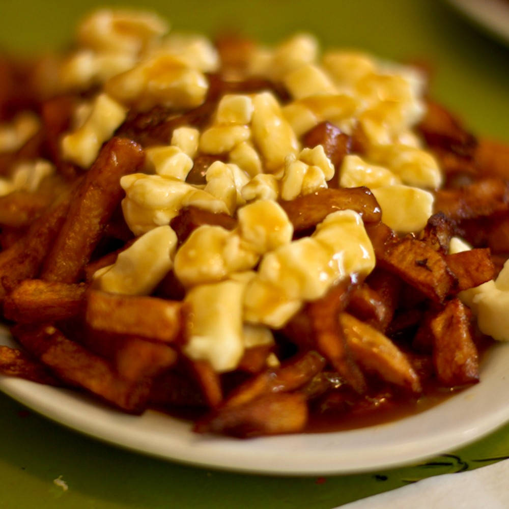 Delishpoutine Cheese Curds On Fries Would Be Translated To 