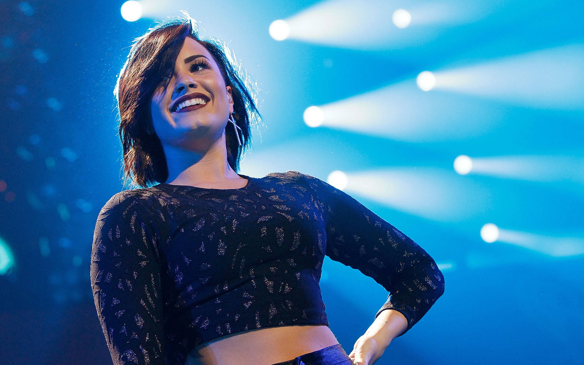 Demi Lovato Against Spotlights Background