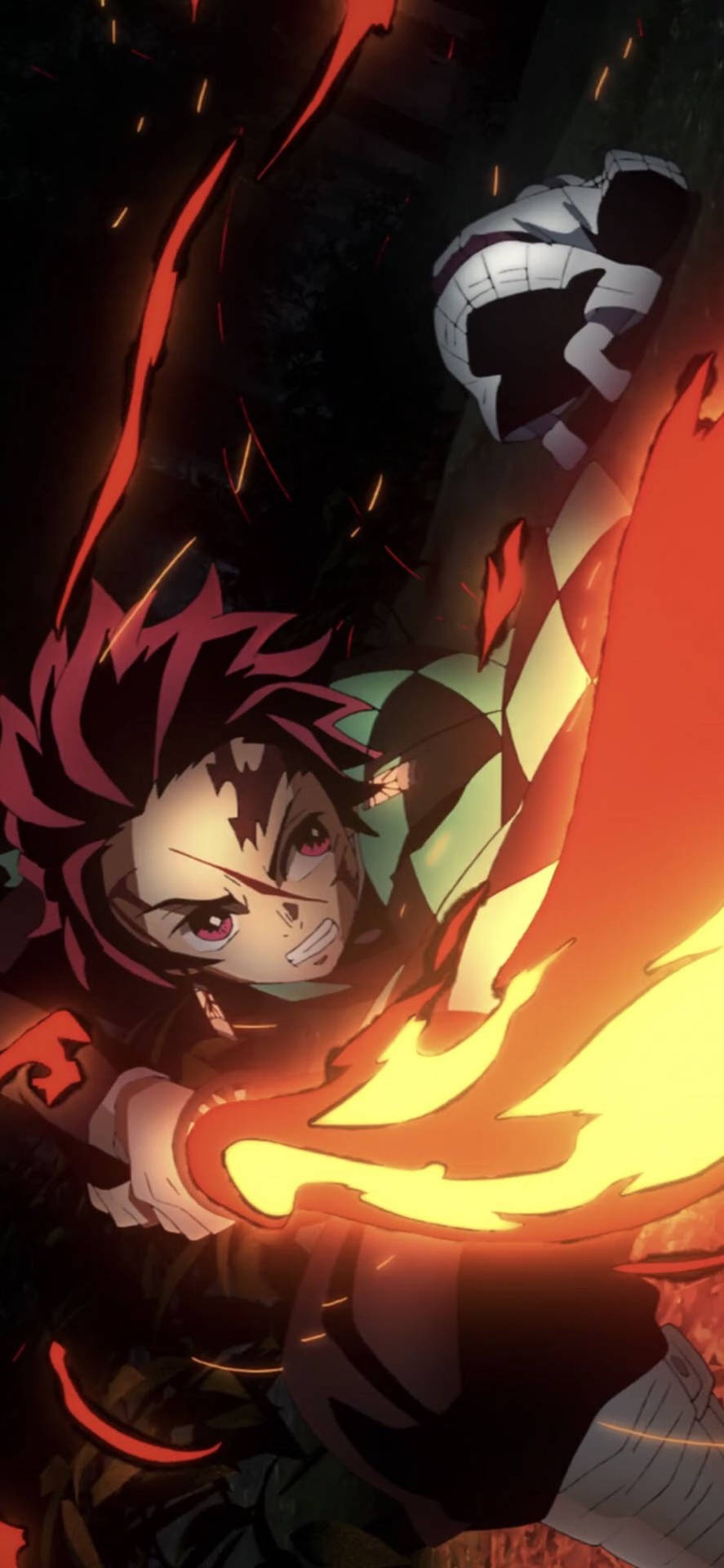 Demon Slayer wallpaper of  Tanjiro attacking with fire breathing technique with his sword. 