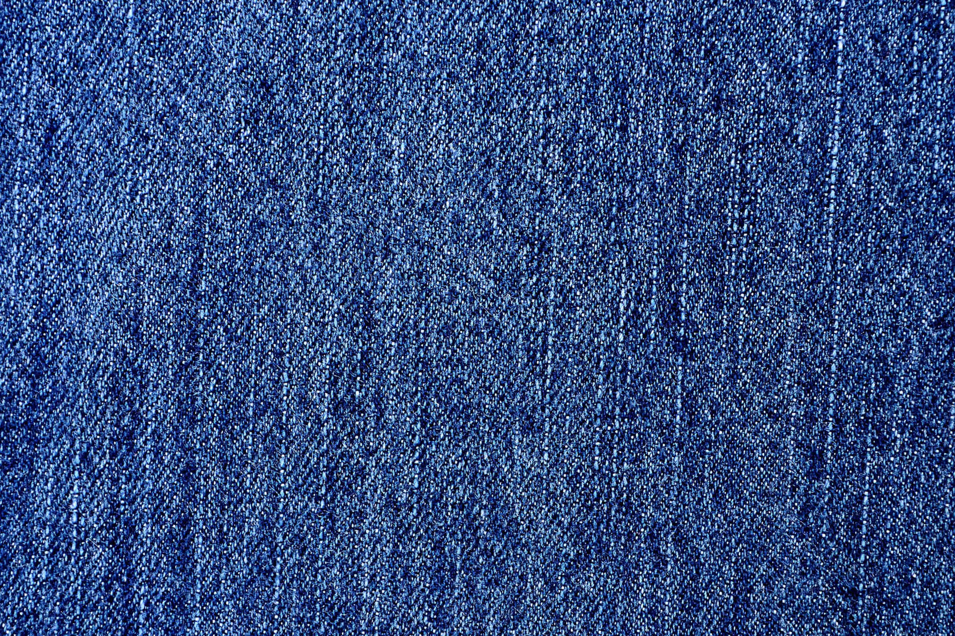 A close-up silhouette image of a pair of worn-in jeans.
