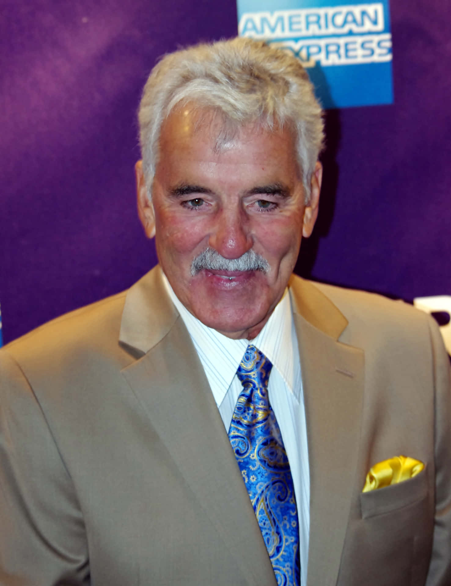 Dennis Farina in a suave and sophisticated pose Wallpaper