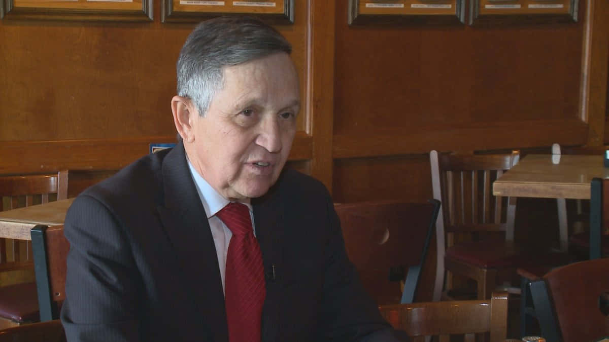 Dennis Kucinich At A Dining Table Wallpaper