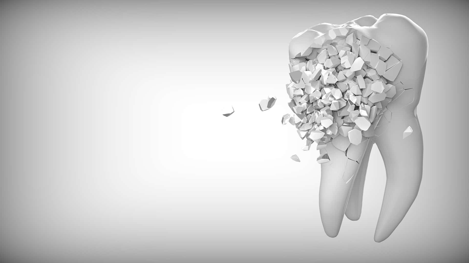 A Tooth Is Broken In Half On A Gray Background