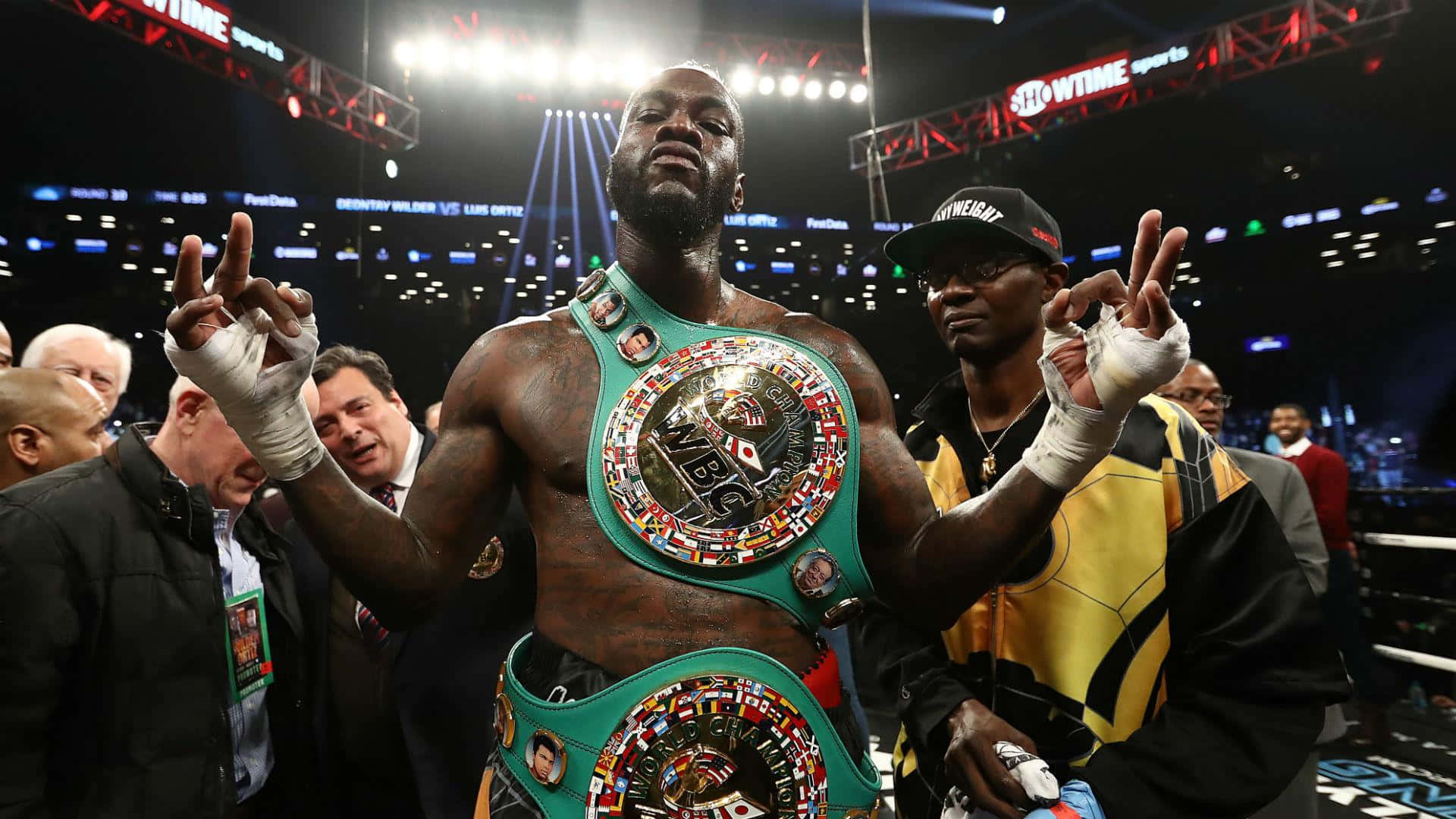 Deontay Wilder Victory Celebration With Belt Wallpaper