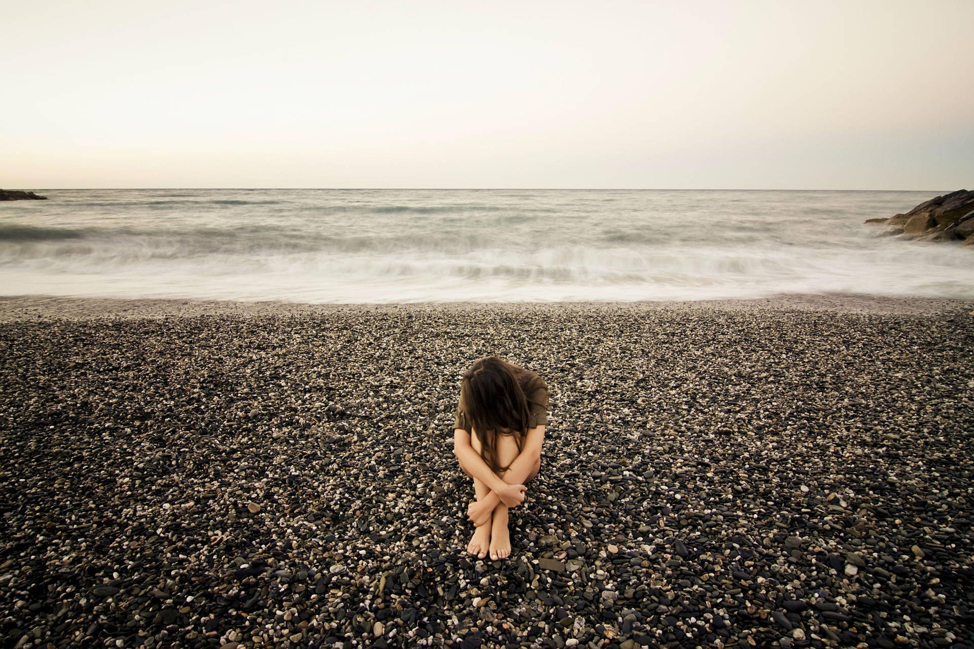 Depressed Girl On Beach Wallpaper