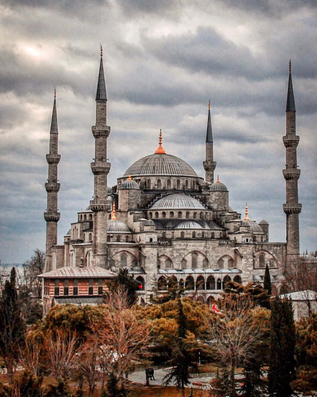 Desaturated Blue Mosque In Stormy Sky Wallpaper