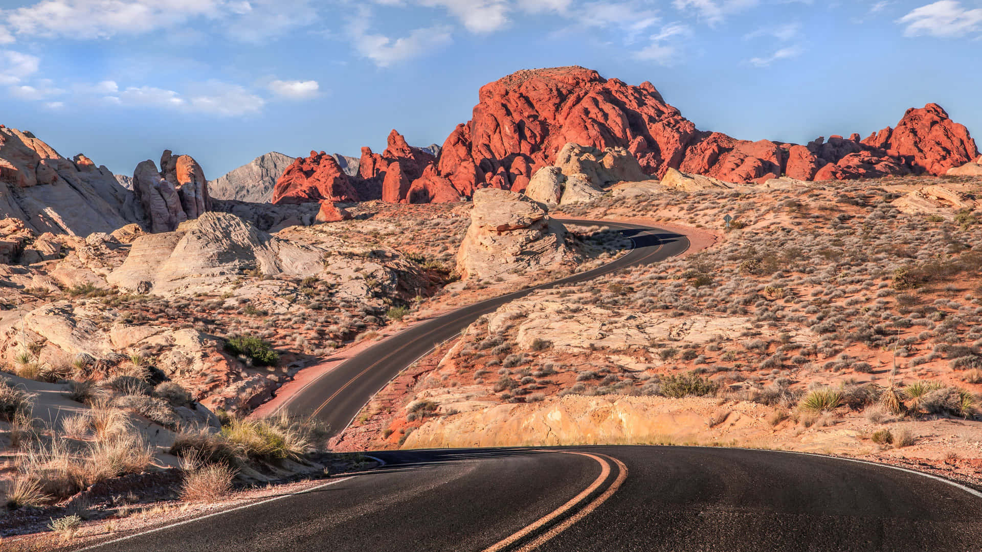 Desert_ Road_ Winding_ Through_ Red_ Rocks Wallpaper