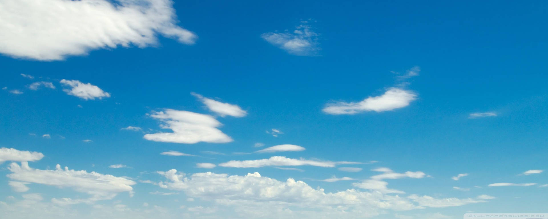 Explore the Blue Hues of the Desert Sky Wallpaper