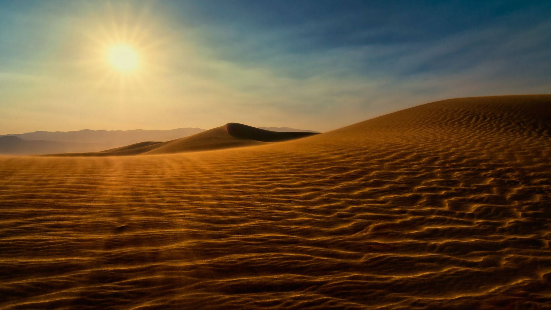 A hot and dry desert under an intense sun. Wallpaper