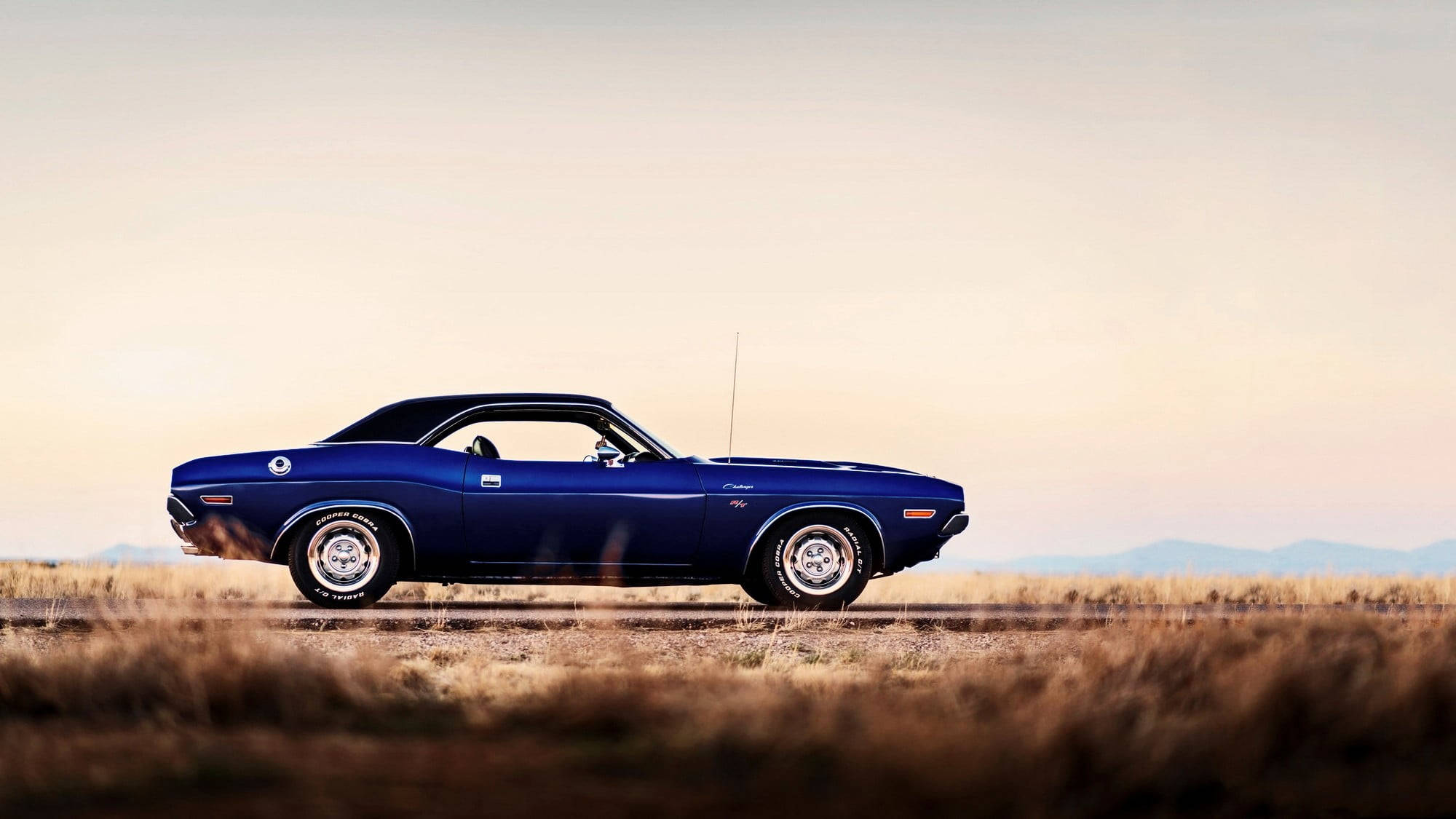 Deserted Navy Blue Dodge Challenger Background