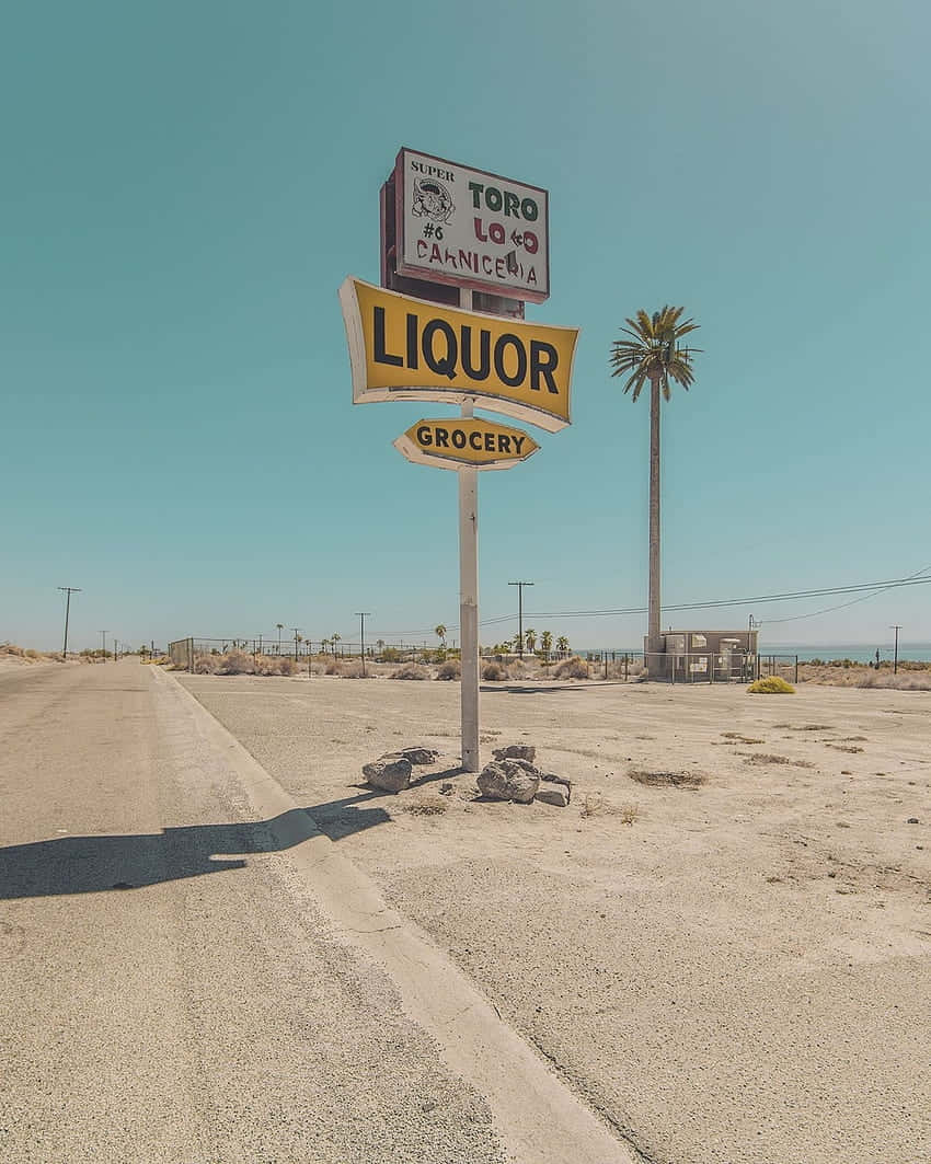 Deserted Roadside Liquor Store Sign Wallpaper