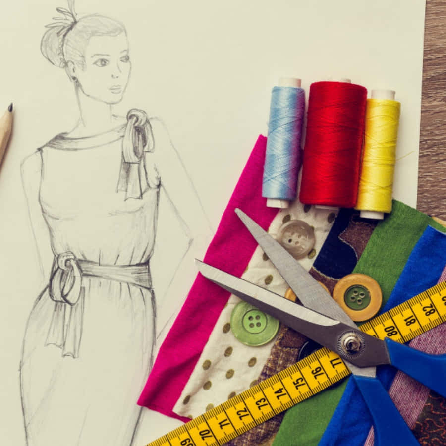 Fashion Designer Drawing A Dress With Scissors And Thread