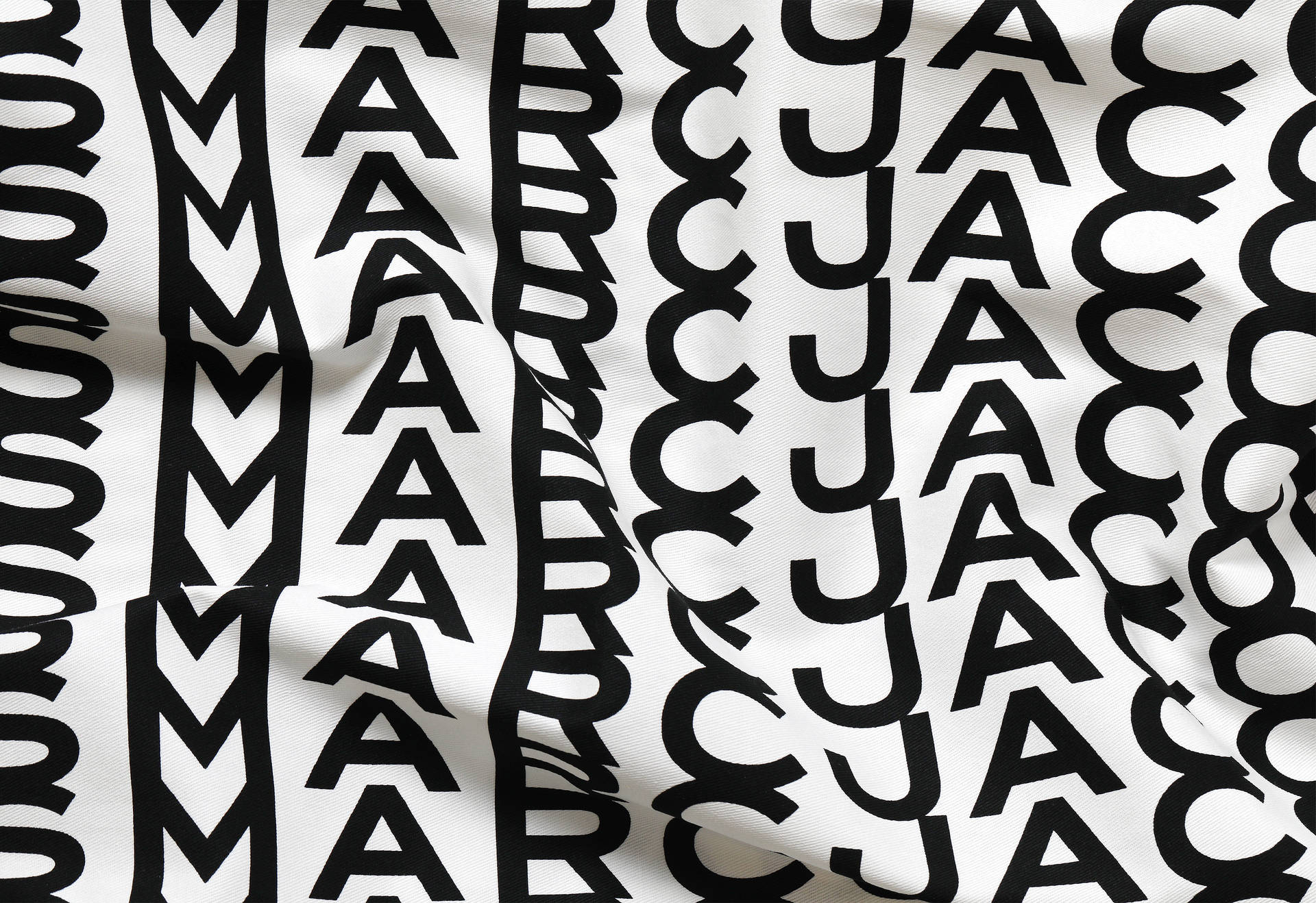 Designer Fabric With Marc Jacobs Logo Wallpaper