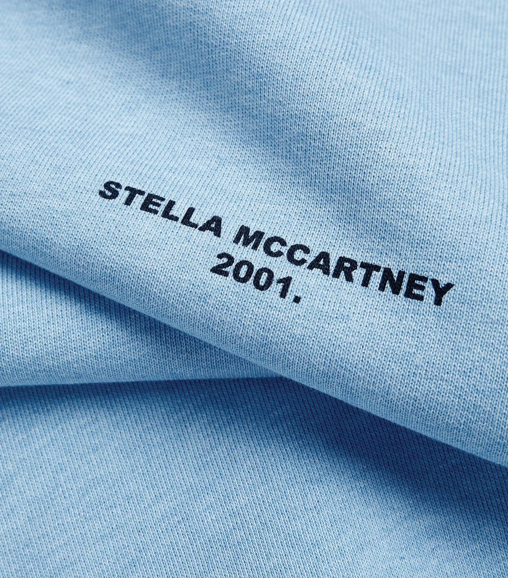 Designer Fabric With Stella McCartney Logo Wallpaper