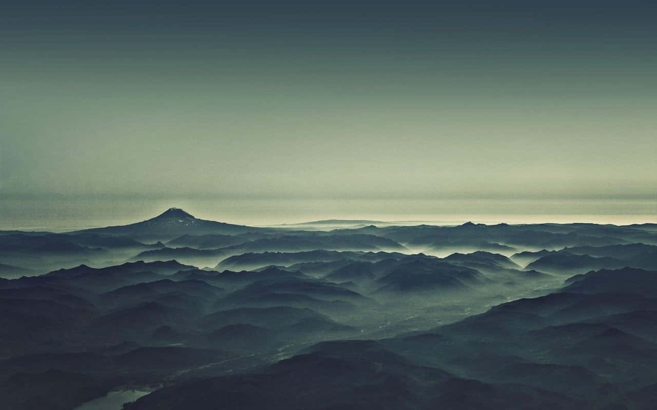 Misty And Rugged Mountain Range Desktop Pc Background