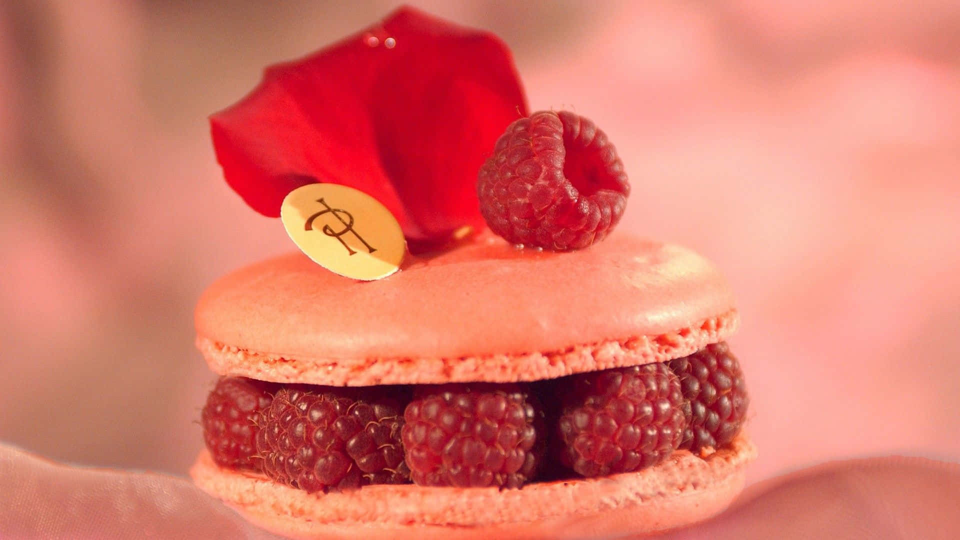 A Pink Macaron With Raspberries