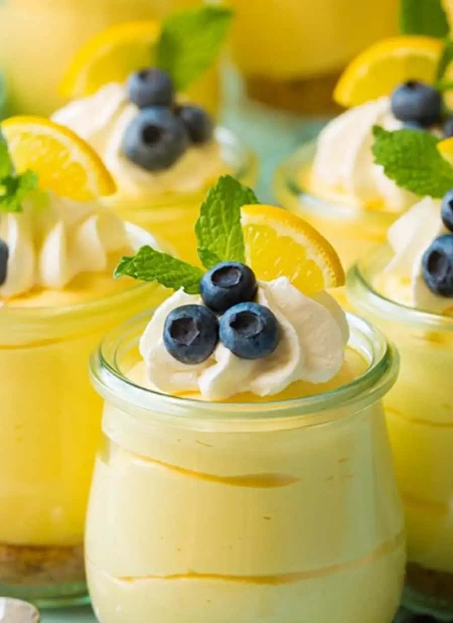 Lemon Cheesecake In Jars With Blueberries And Lemon