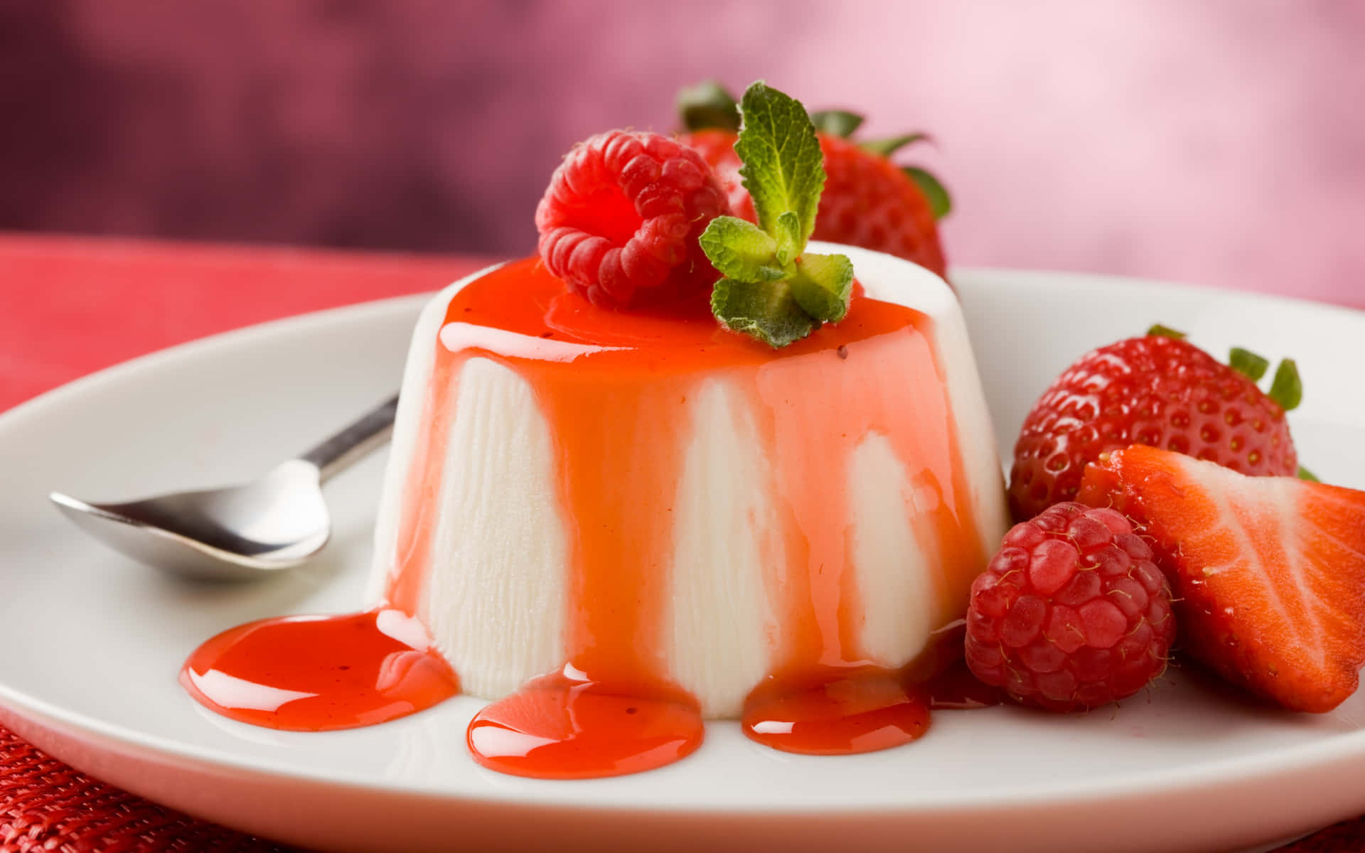 A Plate With A Dessert With Strawberries And Cream
