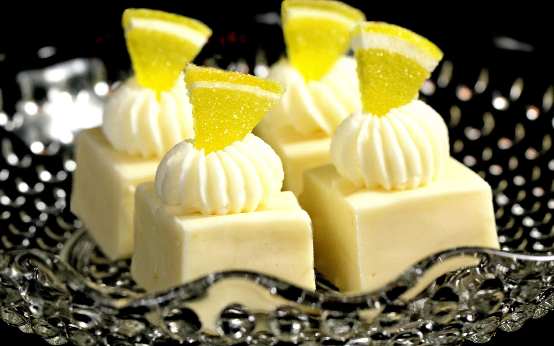 A Glass Plate With Three Lemon Desserts