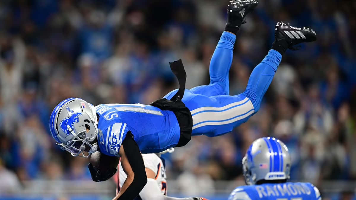 Detroit Lions Player Upside Down Catch Wallpaper