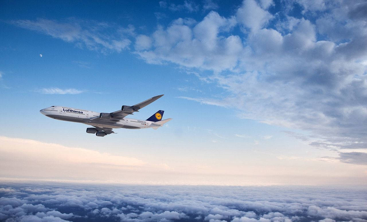 Deutsche Lufthansa Plane With A Panoramic Sky View Background