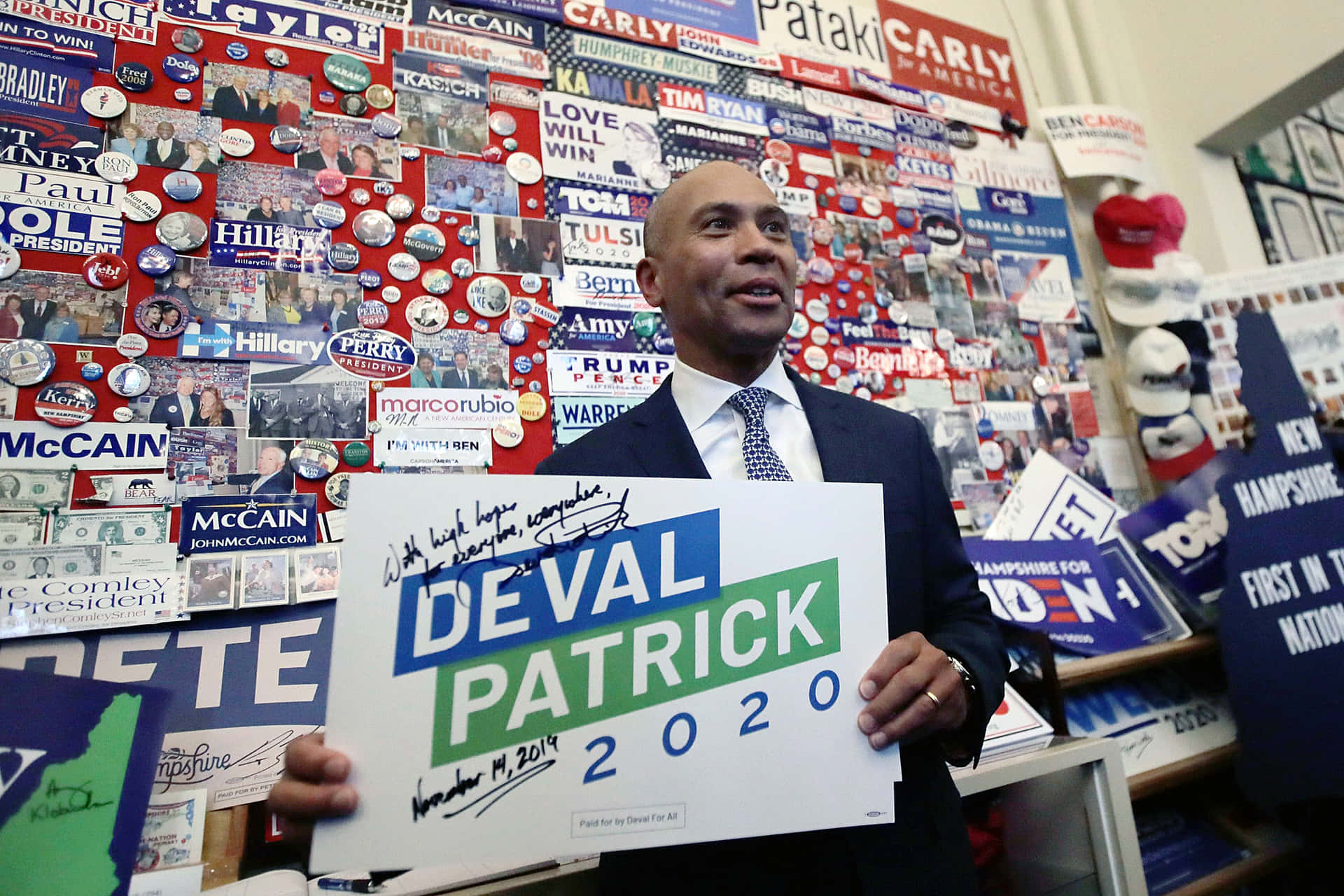 Deval Patrick Signing a Campaign Banner Wallpaper