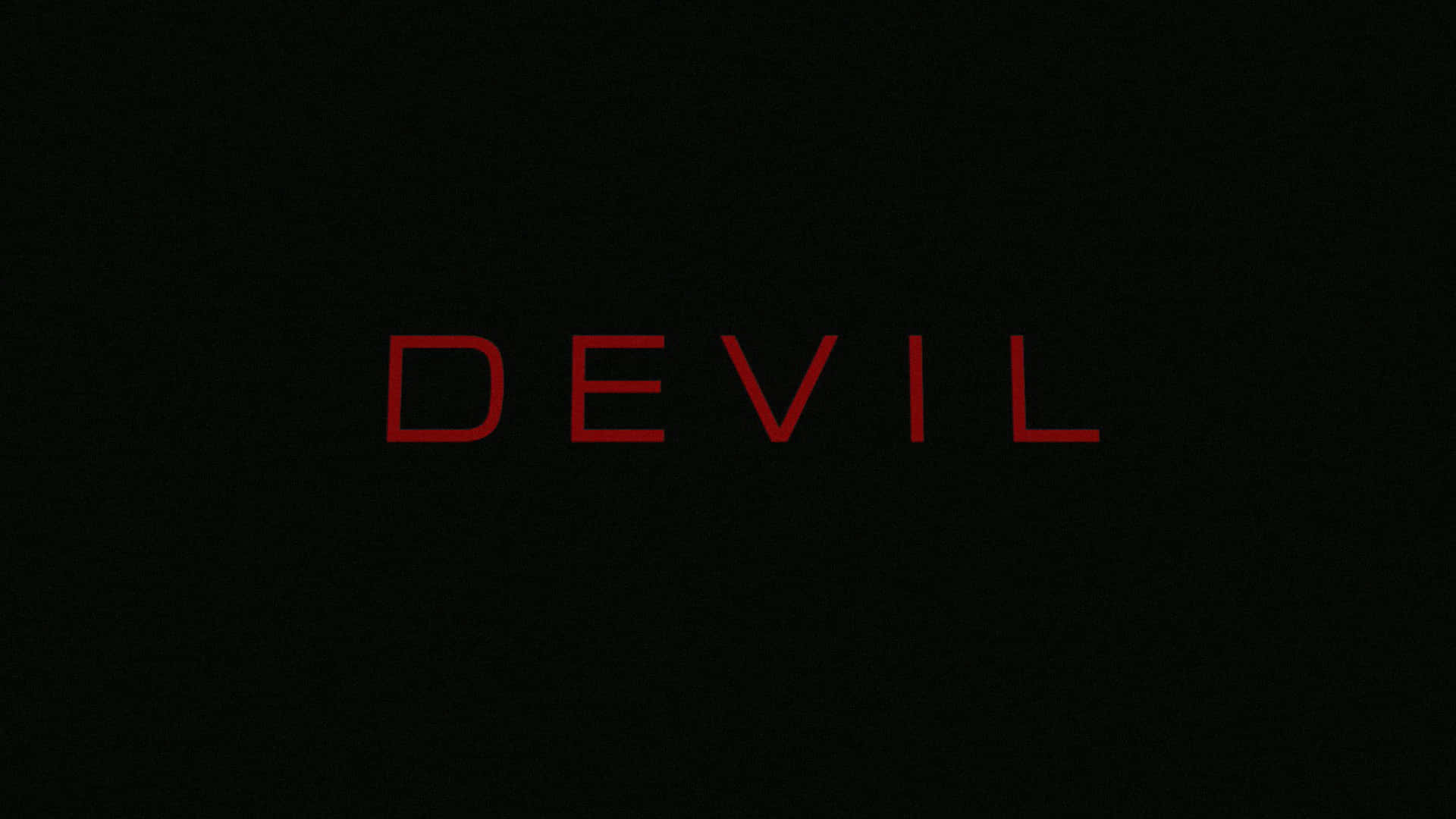 Devil - A Black Background With Red Letters
